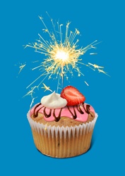 Sparkler burning on top of cupcake