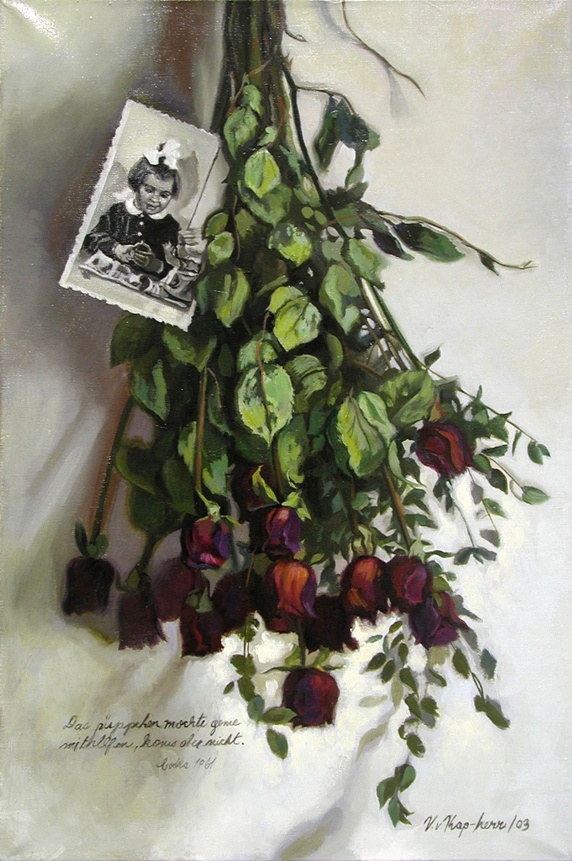 Bouquet of red roses and old photograph