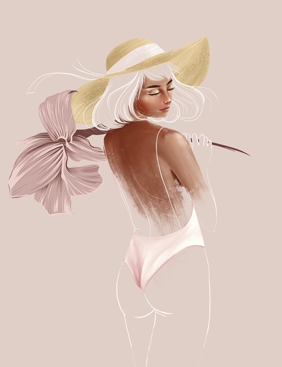 Fashion model in pink swimsuit and sun hat with large flower