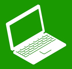 Laptop on green background
