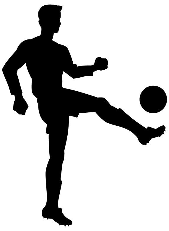 Silhouette of man kicking ball